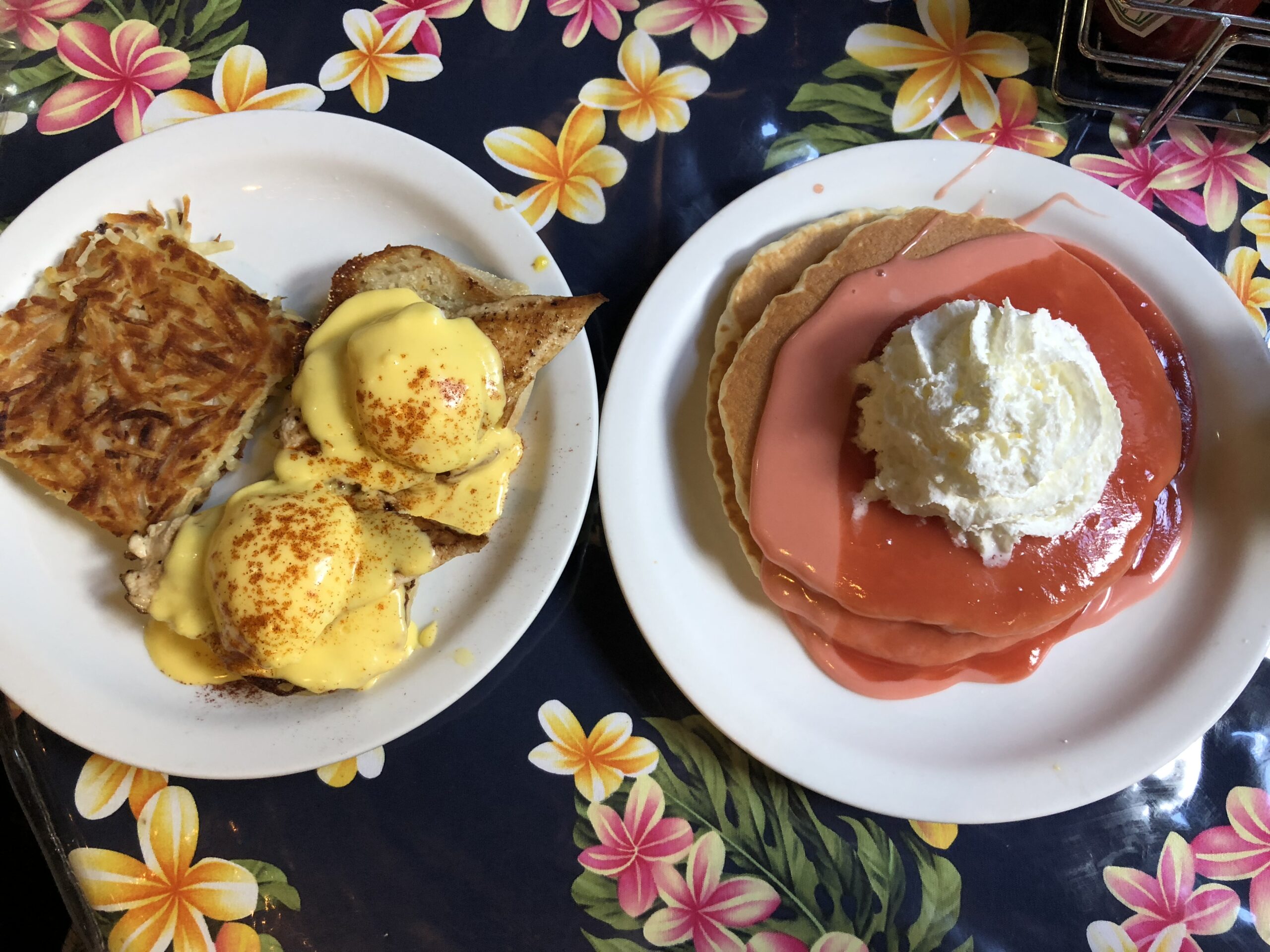 Cinnamon's famous bright pink guava chiffon pancakes and mahi mahi eggs Benedict breakfast