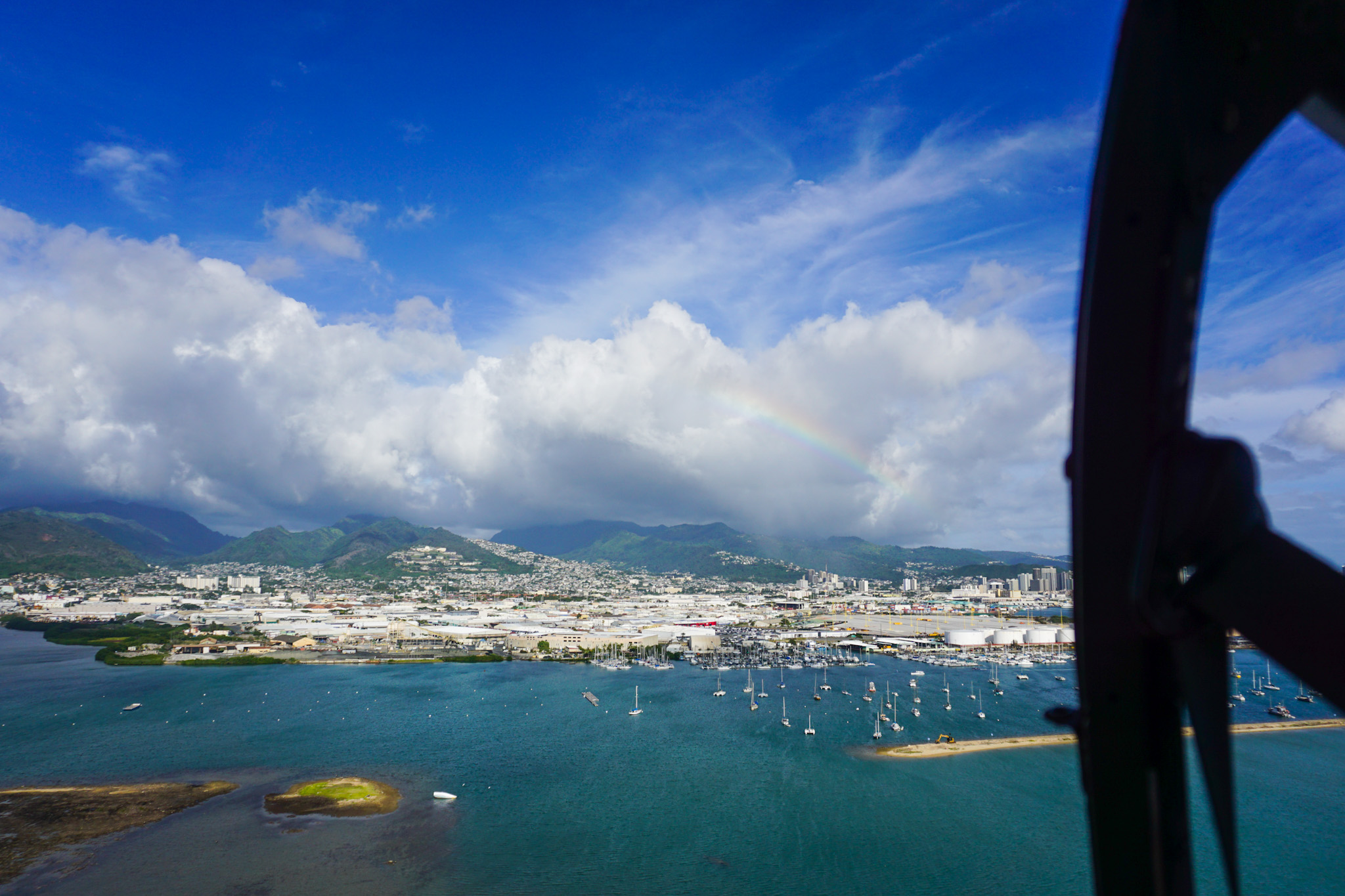 Aerial view from helicopter of rainbow over Honolulu