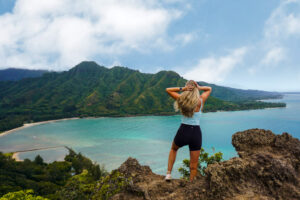 Girl at the top of Crouching Lion hike overlooking Kahana Bay