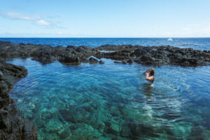 Lauren swimming in tide pool at makapuu in Oahu Hawaii