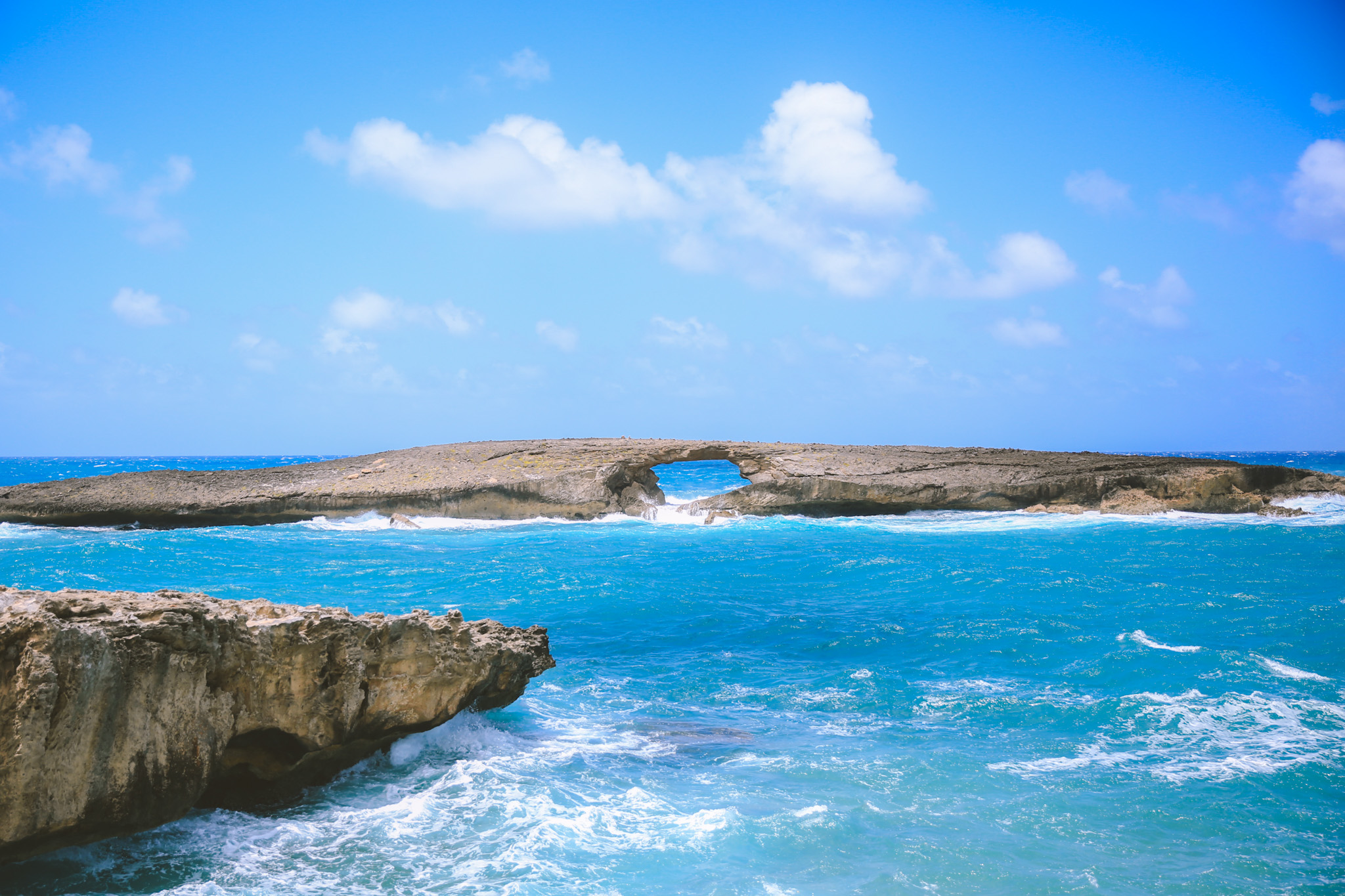 Laie Point - Rocky cliffs with steep drops into the blue ocean on Oahu Hawaii's North Shore
